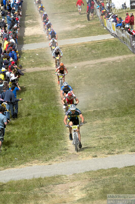 Mountain bike racers form single line. Sea Otter Classic. 2004 — AbbiOrca cycling race photography